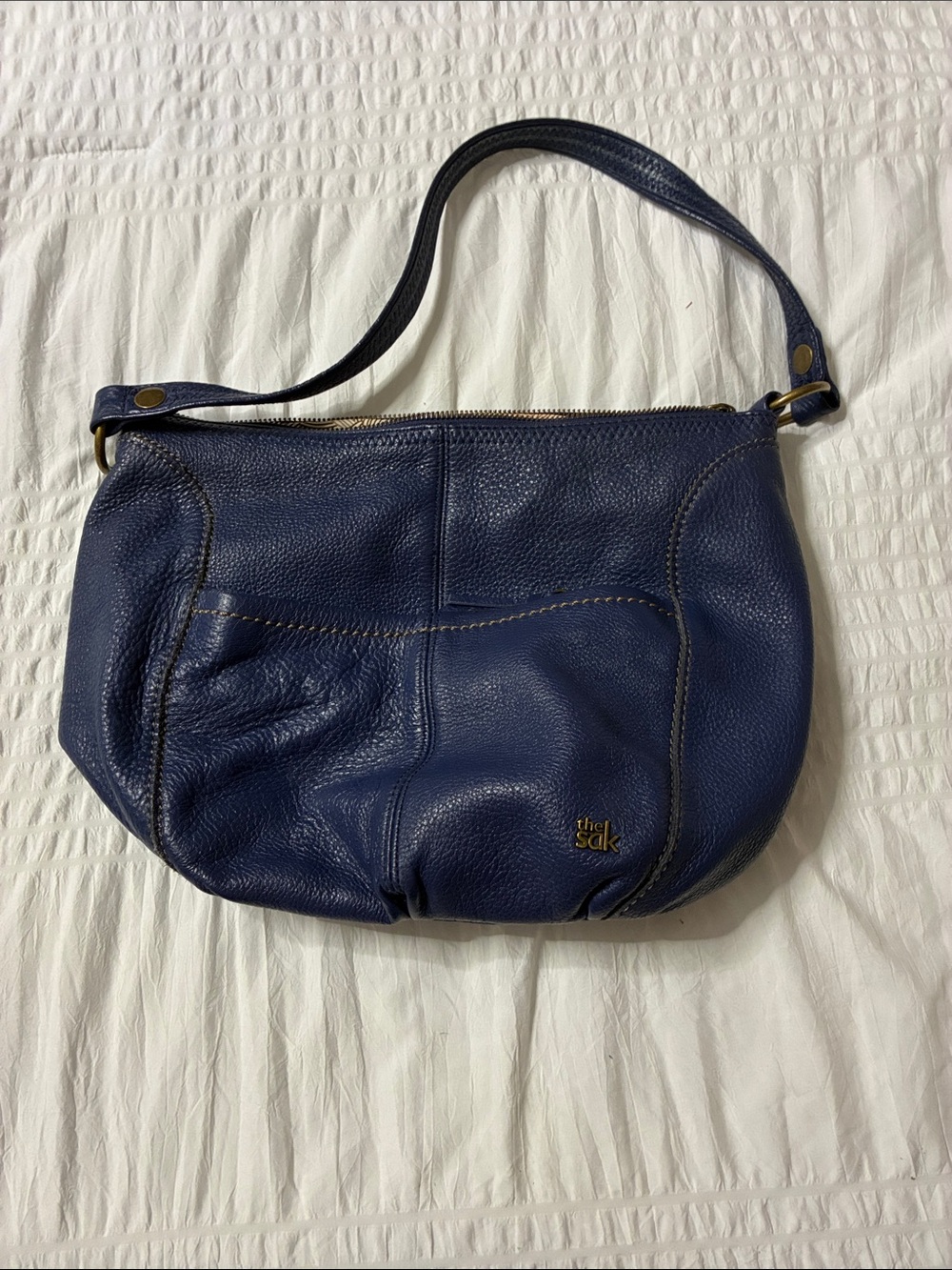 The Sak Navy Pebbled Leather Shoulder Hobo with Gold Accents